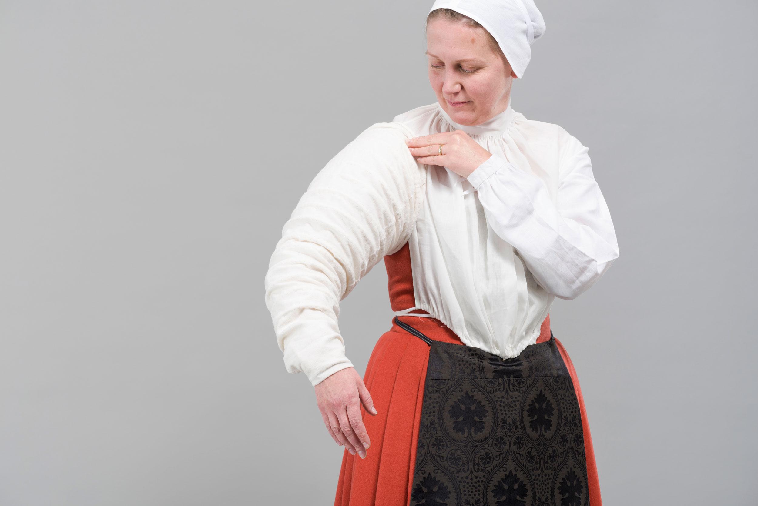 Melanie putting on Farthingale sleeve