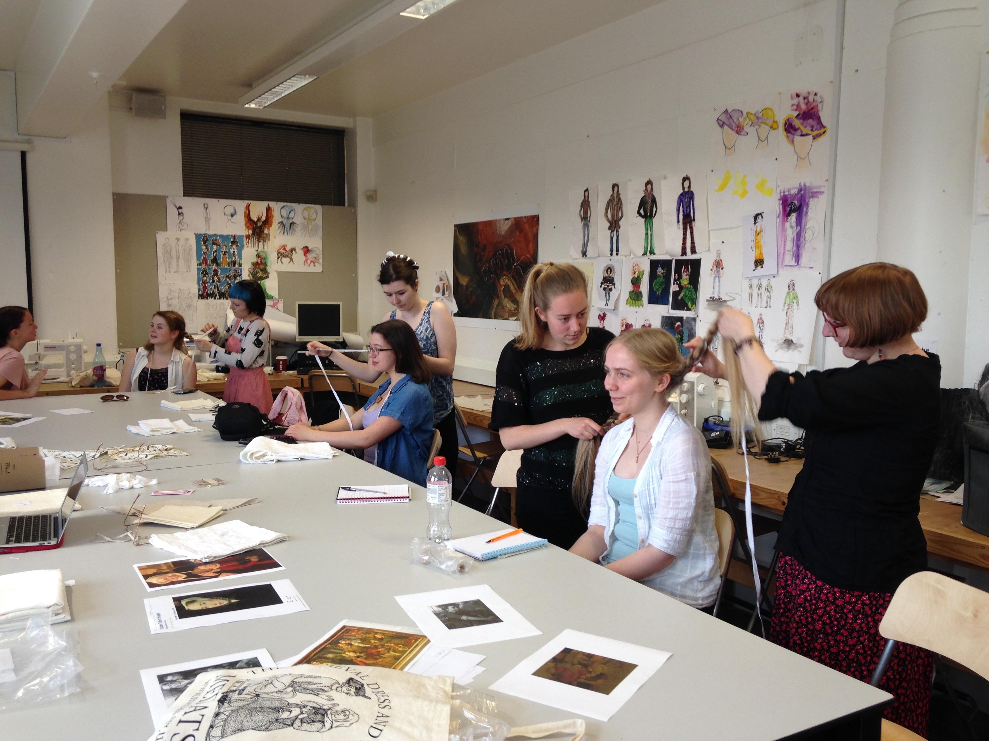 University of Huddersfield students experimenting with hair lacing and head linen